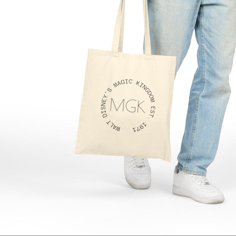 Person holding a tote bag with 'Slainte' text on a white background